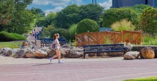 A student walks by the Sophomore Bridge installation at the Student Center Circle.