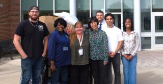 Central students faculty, and staff stand in front of Willard-DiLoreto Hall