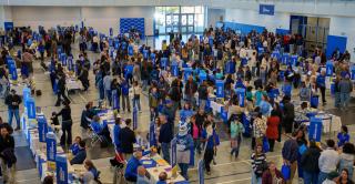 Visitors fill the Huang Recreation Center to learn more about academic, support, and student life options available at Central.