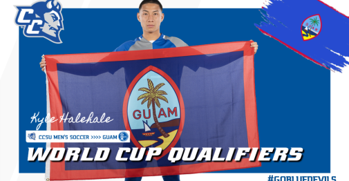 Kyle Halehale posing with Guam flag for WCQ