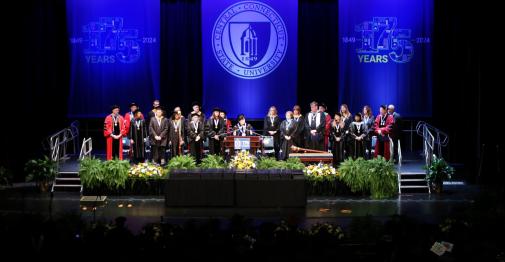 Campus leadership on stage at winter commencement