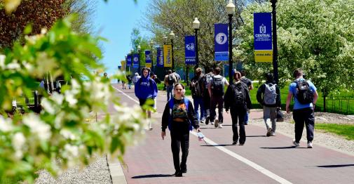 Students walk up the hill on the Central campus
