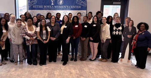 Students, faculty, and guest speakers take a group photo at the 2026 Elect Her training at Central.