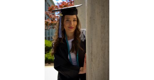 Portrait of Central student Kayla Beaulieu dressed in her cap and gown