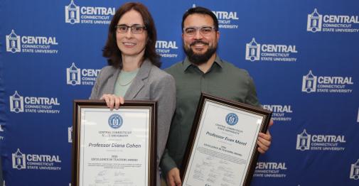 EIT winners Dr. Diana Cohen (Political Science) and Evan Morel ’14 (Engineering) stand against a Central branded backdrop.