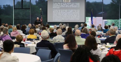 Matt Warhsauer presents a lecture on the American Revolution during a July 7 Scholars for Life event in Memorial Hall.