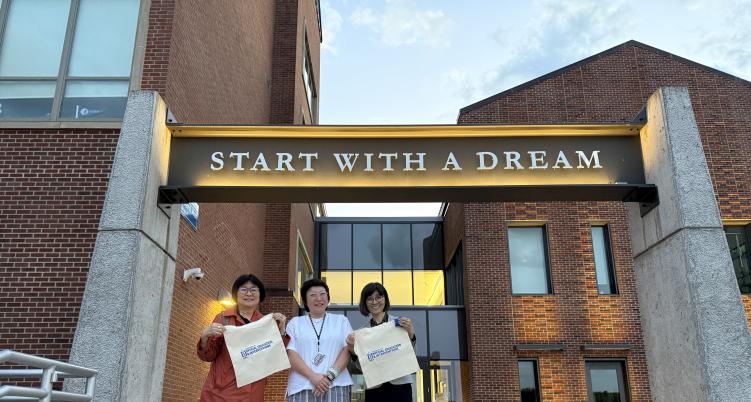 Members of Education Department standing in front of Barnard Hall