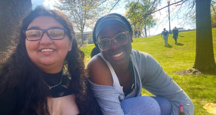 students sitting outside