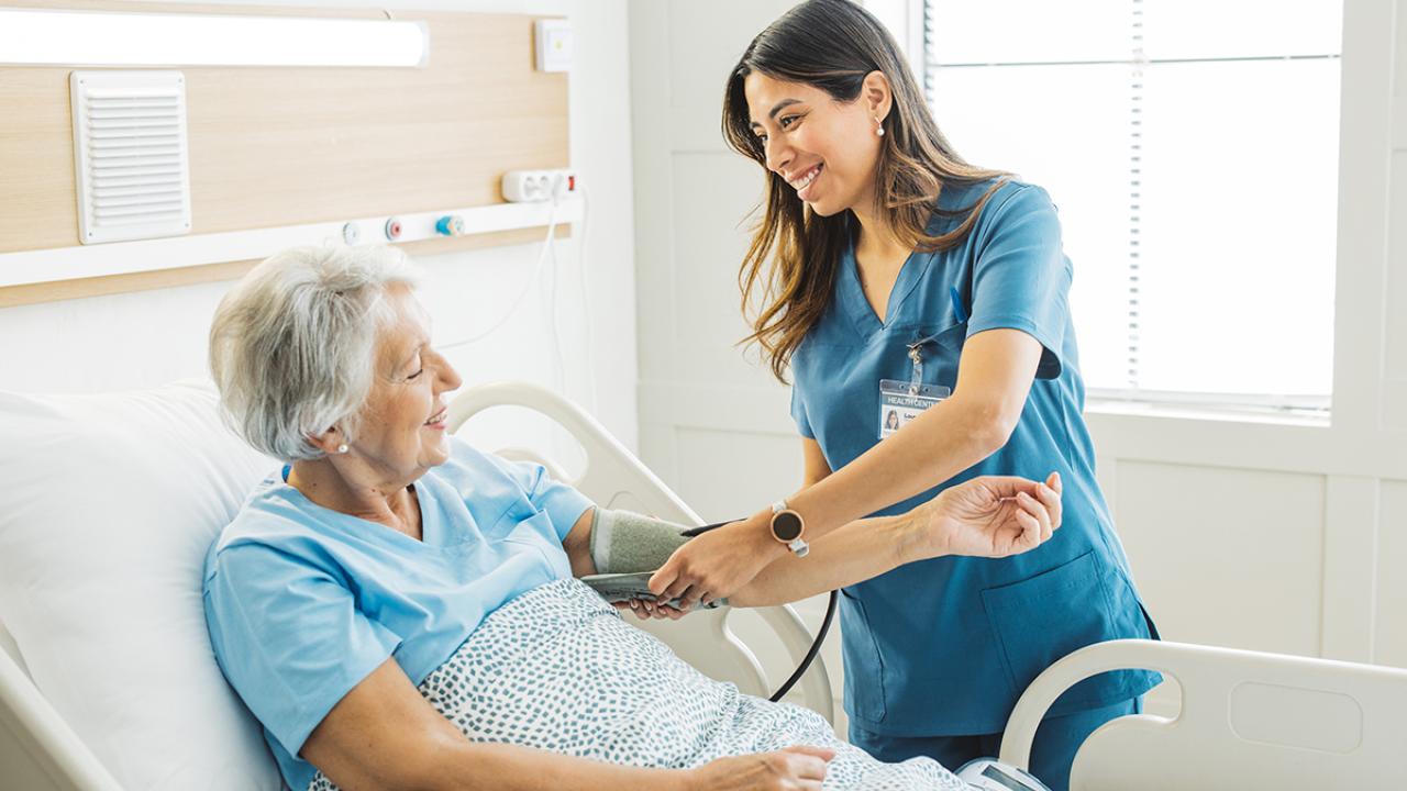 Nurse checking vitals of patient