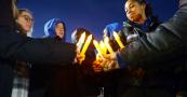 Central Students hold candles during Peace walk for unity