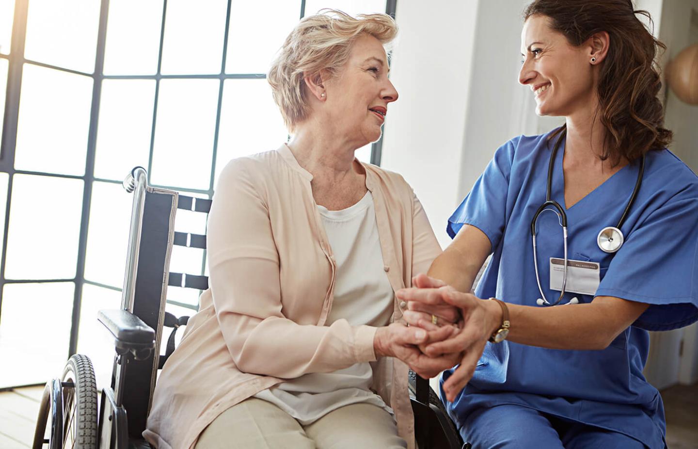 Nurse with patient in wheelchair