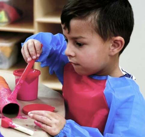 Child in Drop-In Center Painting