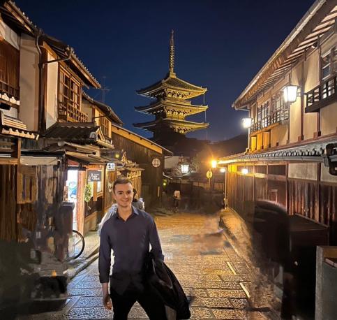 Man on street in Japan at night
