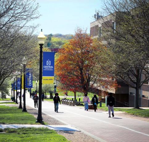 campus photo up the hill with banners