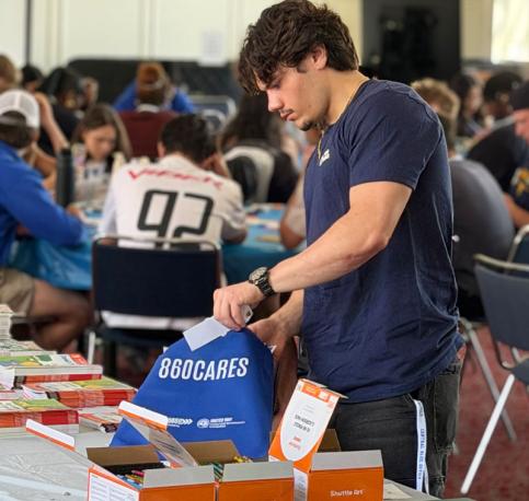 student packing community bags